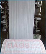 Polypropylene fabric: a narrow sleeve for further production of woven polypropylene sacks width from 30 up to 80 cm.